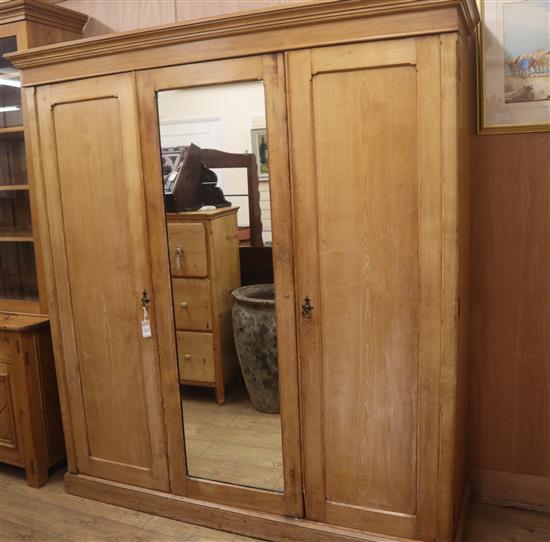 A Victorian pitch pine triple wardrobe W.188cm